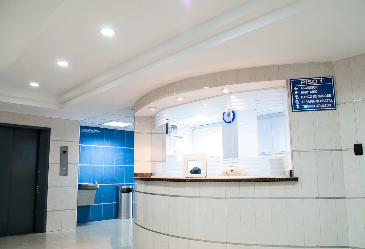 International student consulting a doctor in a bright clinical setting abroad