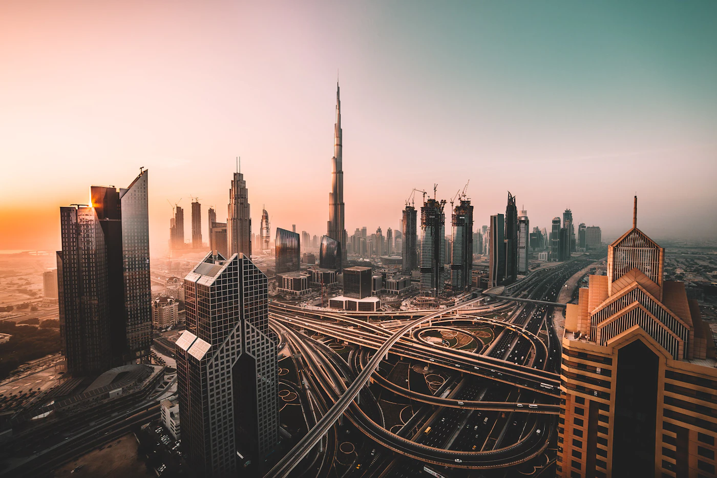 Dubai skyline with Burj Khalifa and modern skyscrapers at sunset
